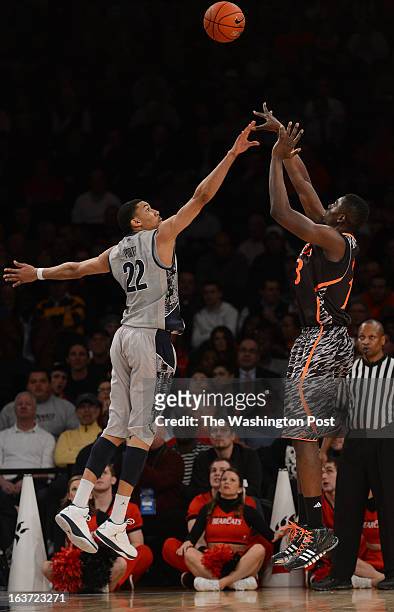 Georgetown Hoyas forward Otto Porter Jr. Disrupts the shot of Cincinnati Bearcats center Cheikh Mbodj during the Quarterfinal Round game of the Big...