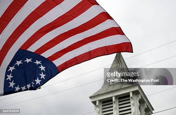 Outwardly-oriented five-pointed stars arranged in a circle, make up the so-called Betsy Ross flag, placed near the St. James United Church of Christ...
