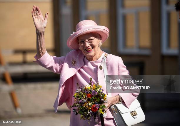 Queen Margrethe II of Denmark waves to onlookers as she visits Fredericia Municipality, Denmark, on September 1 which hosts the Queen's late summer...