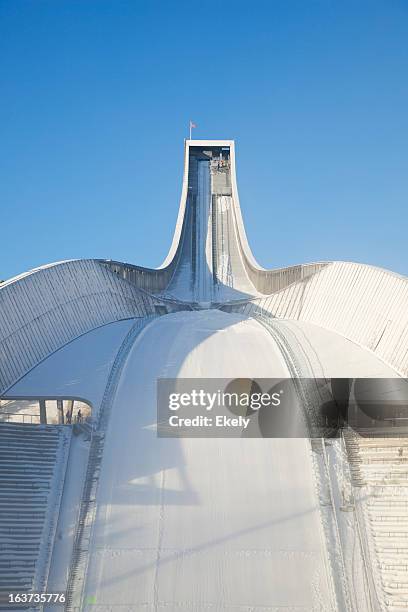 holmenkollen ski jump against blue sky in winter. - ski jumper stock pictures, royalty-free photos & images