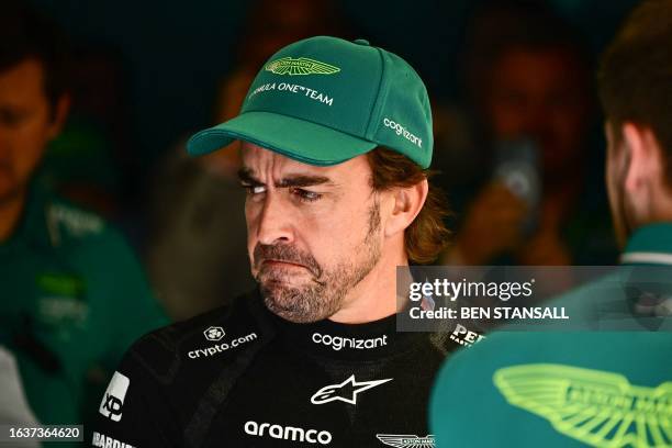 Aston Martin's Spanish driver Fernando Alonso looks on prior to the start of the second practice session, ahead of the Italian Formula One Grand Prix...