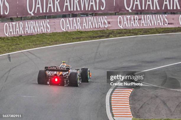 Rear view of the race car of Lando Norris of Great Britain with sparkles, driving the car no 4 a Mercedes MCL60 of McLaren F1 Team on truck during...