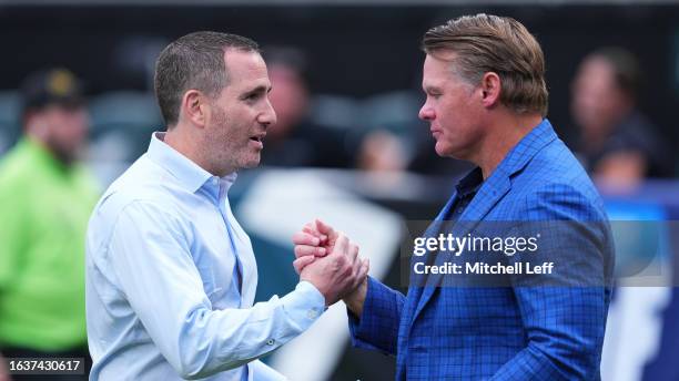 General manager Howie Roseman of the Philadelphia Eagles talks to general manager Chris Ballard of the Indianapolis Colts during the preseason game...