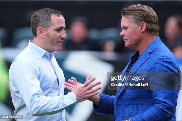 General manager Howie Roseman of the Philadelphia Eagles talks to general manager Chris Ballard of the Indianapolis Colts during the preseason game...