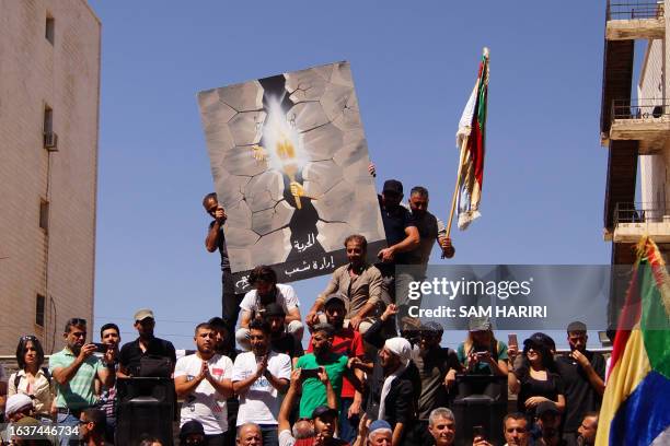 People protest in the Syria's southern city of Sweida on September 1, 2023. The protests in Sweida province, the heartland of the country's Druze...