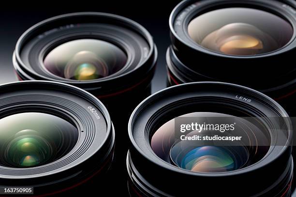 multiple camera lenses, reflective lenses - digitale camera stockfoto's en -beelden