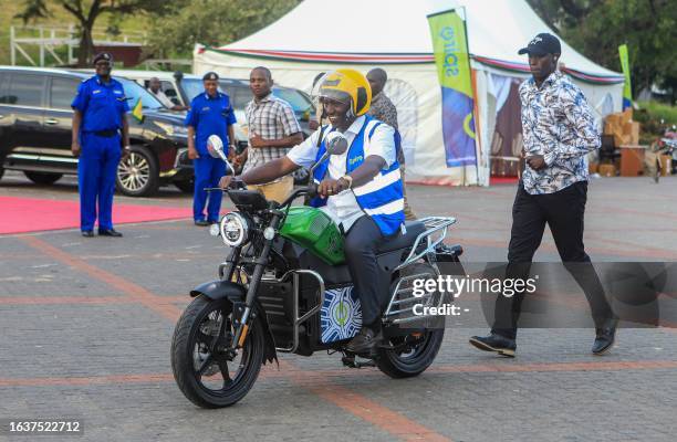 Kenya's President William Ruto uses an electric motorcycle during the national launch of an electric motorcycle project dubbed e-bodaboda at Kenyan...