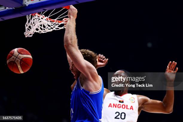 Nicolo Melli of Italy dunks the ball against Bruno Fernando of Angola in the first quarter during their FIBA World Cup Group A game at the Philippine...