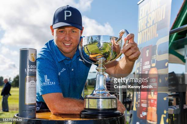 Winner Graeme Robertson with his haul of trophies and whisky following his win on the Final Day of the Loch Lomond Whiskies Scottish PGA Championship...