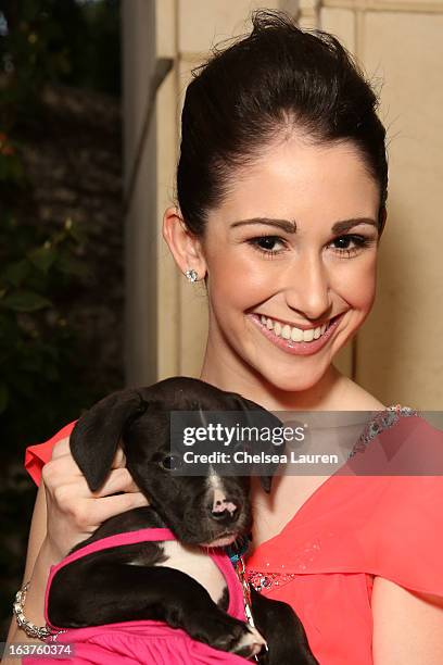Singer Sarah Hackett poses with a dog wearing Lyric Culture for PetSmart at Much Love Animal Rescue's makeovers for mutts at Peninsula Hotel on March...