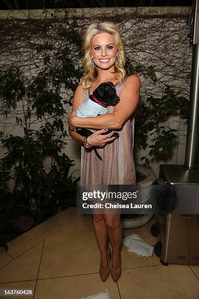 Personality Courtney Friel poses with a dog wearing Lyric Culture for PetSmart at Much Love Animal Rescue's makeovers for mutts at Peninsula Hotel on...