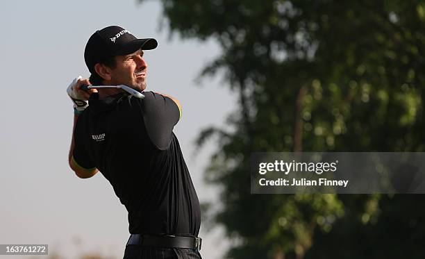 Thomas Aiken of South Africa watches his shot during day two of the Avantha Masters at Jaypee Greens Golf Club on March 15, 2013 in Delhi, India.