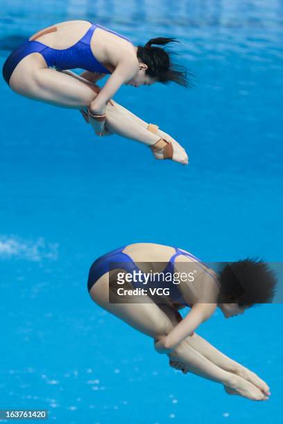 Wu Minxia and Shi Tingmao of China compete in the Women's 3m Springboard Synchro Final during day one of the FINA Diving World Series Beijing Station...