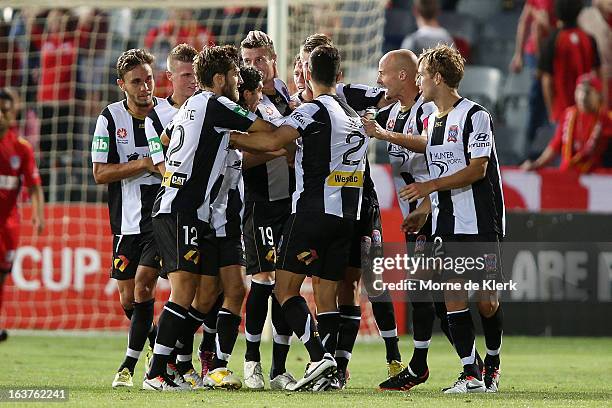 Michael Bridges of the Jets is congratulated by teammates after he scored a goal during the round 25 A-League match between Adelaide United and the...