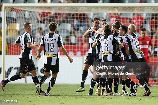 Michael Bridges of the Jets is congratulated by teammates after he scored a goal during the round 25 A-League match between Adelaide United and the...