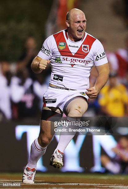 Michael Weyman of the Dragons celebrates after scoring the opening try for the Dragons during the round two NRL match between the St George Dragons...