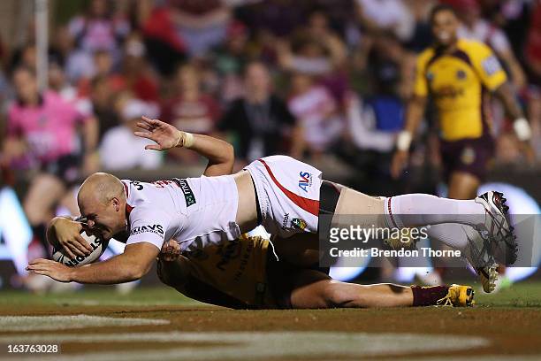 Michael Weyman of the Dragons dives to score the opening try for the Dragons during the round two NRL match between the St George Dragons and the...
