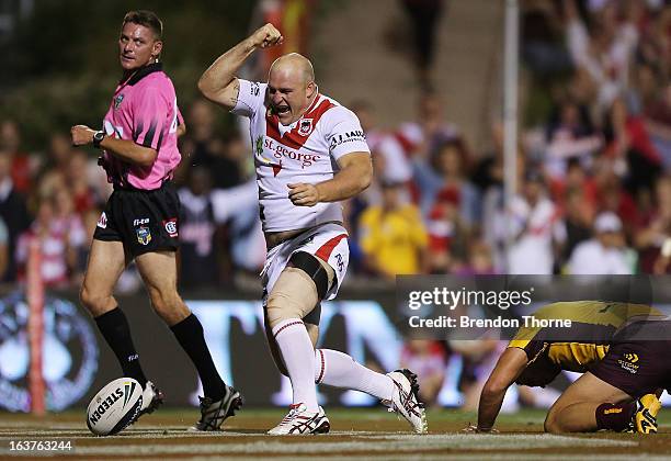 Michael Weyman of the Dragons celebrates after scoring the opening try for the Dragons during the round two NRL match between the St George Dragons...