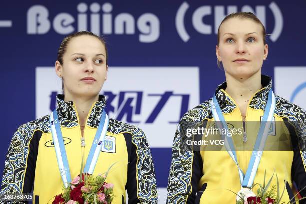 Bronze medalists Anna Pysmenska and Olena Fedorova of Ukraine pose after the Women's 3m Springboard Synchro Final during day one of the FINA Diving...