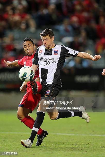 Cassio of Adelaide competes with Michael Bridges of the Jets during the round 25 A-League match between Adelaide United and the Newcastle Jets at...