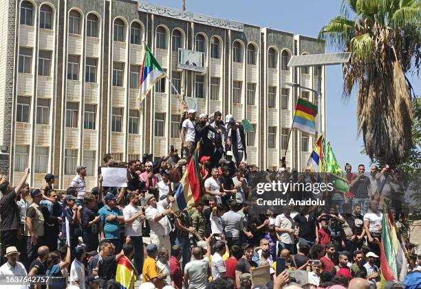 People gather to protest against Bashar al-Assad regime in Al Suwayda, Syria on September 01, 2023. Thousands of people gathered in Syria's Idlib,...