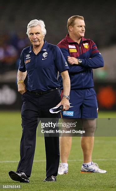 Carlton Blues coach Michael Malthouse walks off in front of Brisbane Lions coach Michael Voss after losing the NAB Cup AFL Grand Final match between...