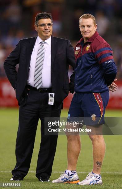 Andrew Demetriou stands with victorious Brisbane Lions coach Michael Voss after the NAB Cup AFL Grand Final match between the Carlton Blues and the...