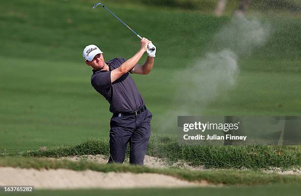 Michael Hoey of Northern Ireland plays out of a bunker during day two of the Avantha Masters at Jaypee Greens Golf Club on March 15, 2013 in Delhi,...