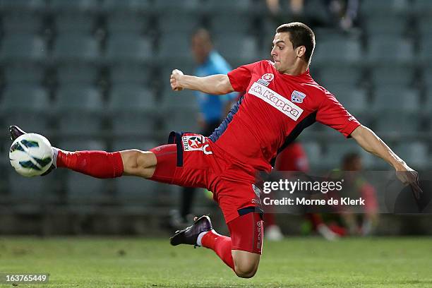 Tomi Juric of Adelaide kicks the ball during the round 25 A-League match between Adelaide United and the Newcastle Jets at Hindmarsh Stadium on March...