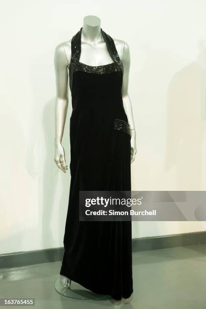 Catherine Walker black velvet and beaded evening gown used in a Mario Testino shoot for Vanity Fair at Kensington Palace 1997 is displayed at a...