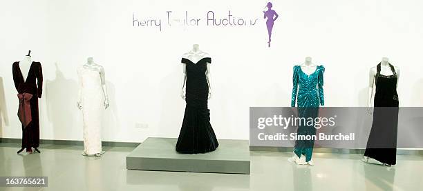 Catherine Walker black velvet and beaded evening gown worn for a Mario Testino shoot for Vanity Fair at Kensington Palace in 1997 is displayed at a...