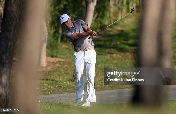 Niclas Fasth of Sweden plays through the trees during day two of the Avantha Masters at Jaypee Greens Golf Club on March 15, 2013 in Delhi, India.