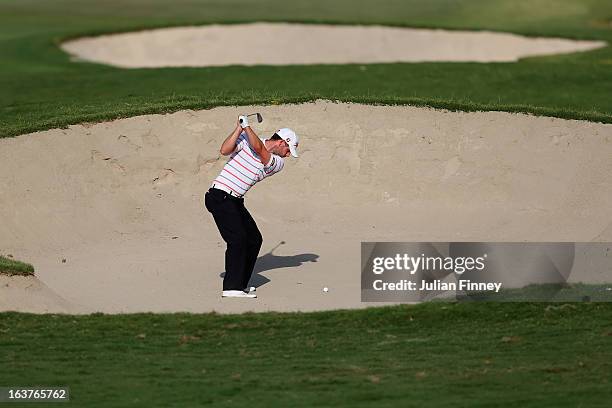 Paul Waring of England plays out of a bunker during day two of the Avantha Masters at Jaypee Greens Golf Club on March 15, 2013 in Delhi, India.