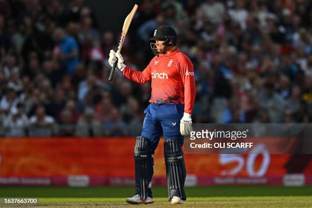 England's Jonny Bairstow celebrates reaching his half century during the second T20 international cricket match between England and New Zealand at...