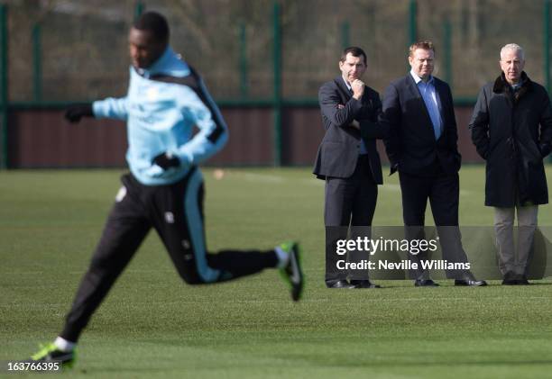 Aston Villa's Head of Media Brian Doogan, Chief Executive Paul Faulkner, Chairman Randy Lerner watch an Aston Villa training session at the club's...