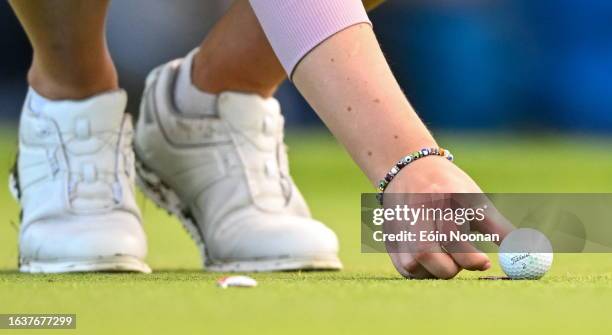 Clare , Ireland - 1 September 2023; A detailed view of Áine Donegan placing a titleist ball on the 17th green during day two of the KPMG Women's...