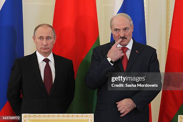 Belarusian President Alexander Lukashenko and Russian President Vladimir Putin attend a meeting at Konstantinovsky Palace on March 15, 2013 in Saint...