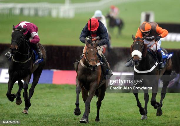 Barry Geraghty riding Bobs Worth clear the last to win The Betfred Cheltenham Gold Cup Steeple Chase from Sir des Champs and Long Run ) during...