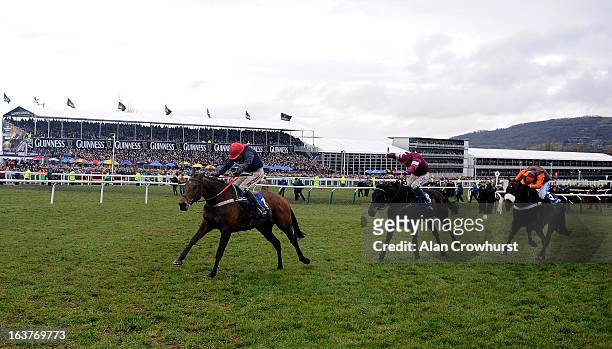 Barry Geraghty riding Bobs Worth clear the last to win The Betfred Cheltenham Gold Cup Steeple Chase from Sir des Champs and Long Run ) during...