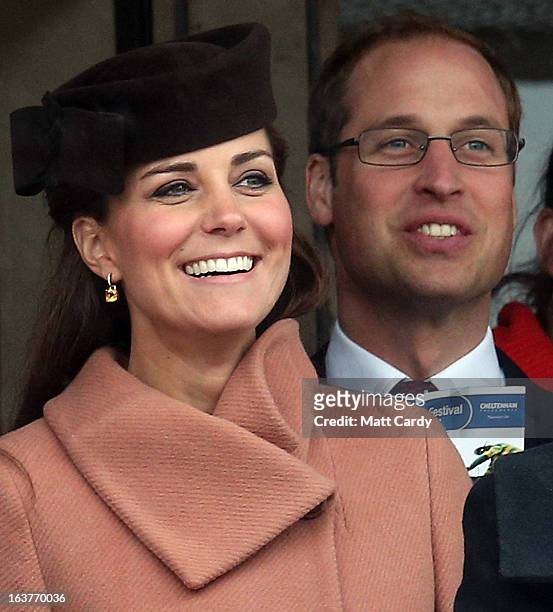 Catherine, Duchess of Cambridge and Prince William, Duke of Cambridge watch the races on Gold Cup Day at Cheltenham Racecourse on the fourth and...