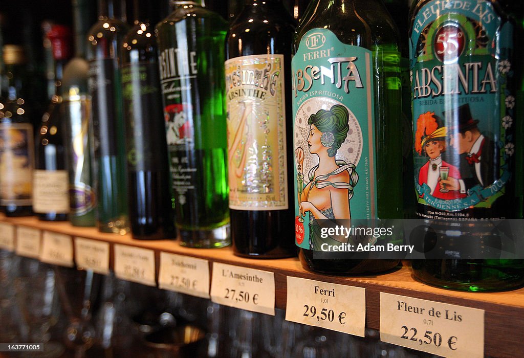 Absinthe Def Bottles of absinthe sit on a shelf for sale at the Absinth Depot shop ...
