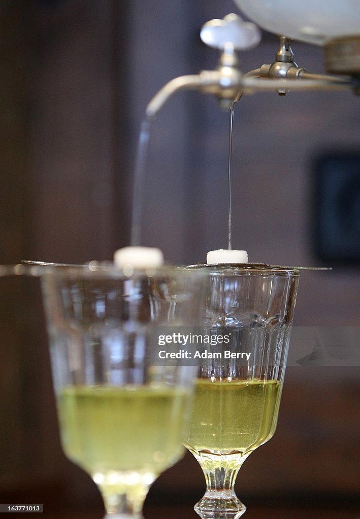Absinthe Def An absinthe fountain drips water through sugar cubes atop absinthe ...