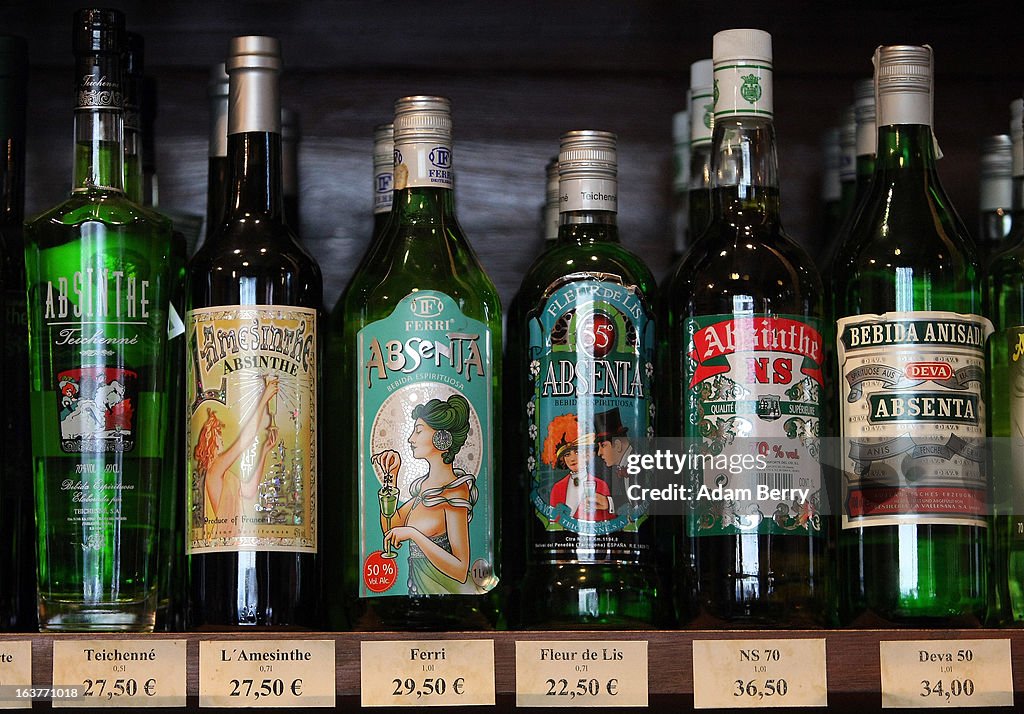 Absinthe Def Bottles of absinthe sit on a shelf for sale at the Absinth Depot shop ...