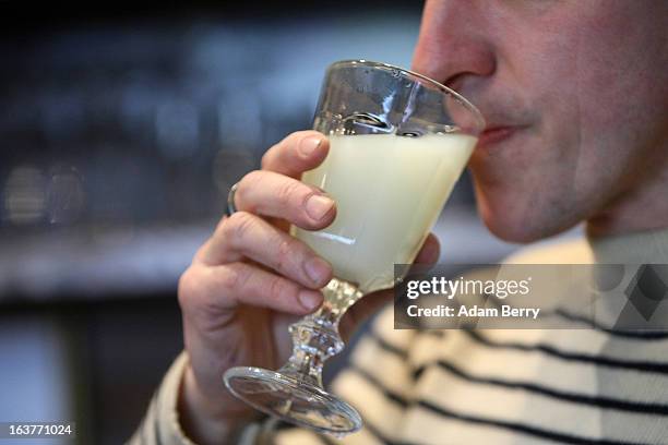 Martial Philippi, owner of the Absinth Depot shop, tastes a glass of absinthe on March 15, 2013 in Berlin, Germany. The highly alcoholic drink...