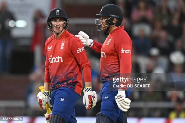 England's Harry Brook (L0 is consoled by England's Jonny Bairstow after losing his wicket for 67 runs during the second T20 international cricket...