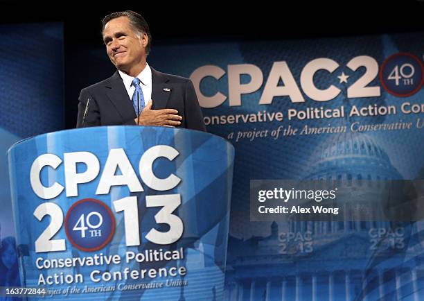 Former Republican presidential candidate and former Massachusetts Governor Mitt Romney acknowledges the crowd as he delivers remarks during the...