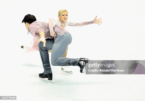 Tatiana Volosozhar and Maxim Trankov of Russia compete in the Pairs Free Skating during the 2013 ISU World Figure Skating Championships at Budweiser...