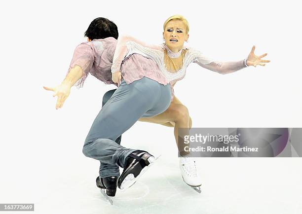 Tatiana Volosozhar and Maxim Trankov of Russia compete in the Pairs Free Skating during the 2013 ISU World Figure Skating Championships at Budweiser...