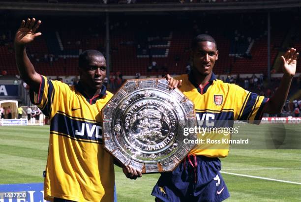 Christopher Wreh and Nicolas Anelka of Arsenal celebrate with the FA Charity Shield at Wembley Stadium in London. Both Wreh and Anelka scored as...