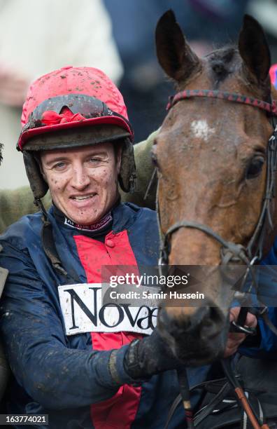 Bobs Worth and Barry Geraghty celebrate winning the Gold Cup on day 4 of the Cheltenham Festival on Gold Cup Day at Cheltenham racecourse on March...